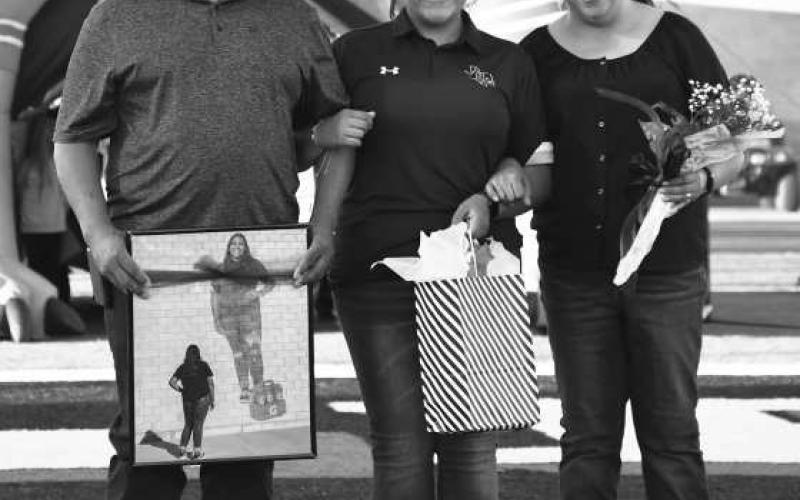 SENIOR TRAINER- Levelland seniors were recognized last Friday during the Lobos home game against Borger. Trainer Cecilia Berumen was escorted by her parents Manuel and Laura Berumen. (Staff Photo by Dom Puente)