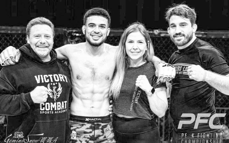 MIGHTY MATEO - Levelland’s own Mateo Gonzalez has found the win column again after defeating Brandon Menneses in the Peak Fighting 29 event, in Amarillo, June 10. Pictured from L-R are: Head Coach John Moore, Mateo Gonzalez, Shannon Morton and former UFC fighter T.J, Waldburger. (Photo Courtesy of Daisy Murray )