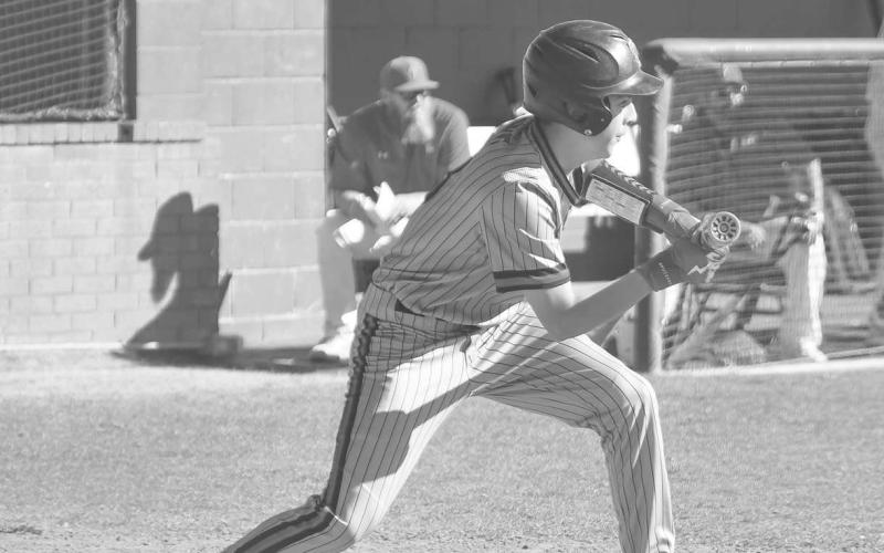 BUNT - Levelland Lobo Anson McMahon got ready to bunt the ball for the Lobos during their contest last Tuesday night in their Linedrive Classic Tournament. (Staff photo by Dom Puente)