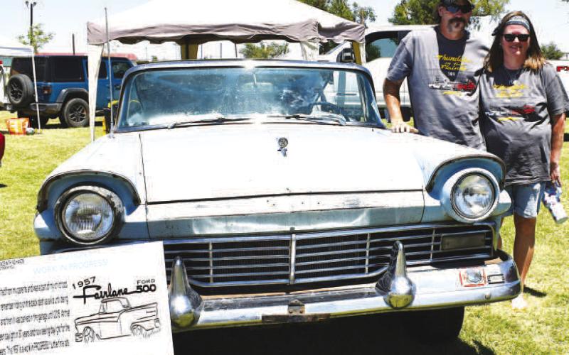 WORK IN PROGRESS – Pictured are Richard and Kim Thyfault with their 1957 Ford Fairlane Skyliner at the 20th annual Thunder on the Plains car show. The car won first place in the Project in Progress class and was featured on this year’s T-shirts, which were sponsored by the 509 Restaurant. (Staff photo by Ada Niederhauser)