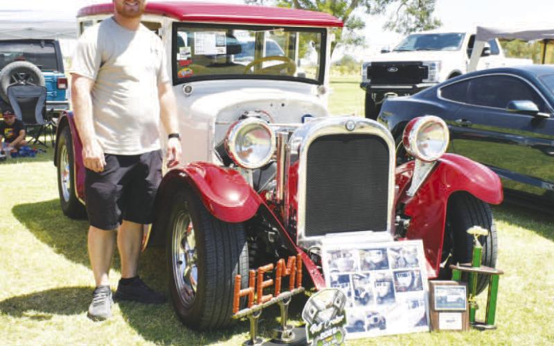 GENERATIONAL PROJECT - Pictured is Scott Lybarger with a 1927 Dodge Sedan. Lybarger is the third generation in his family to own the car and said he is continuing to fix it up for his late father. (Staff photo by Ada Niederhauser)
