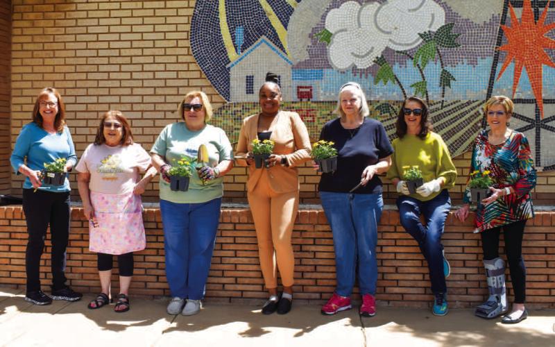 BEAUTIFUL MARIGOLDS - The Levelland Chamber of Commerce Marigold organization planted marigold flowers to attract pollinating insects like bees and butterflies. Pollinators support healthy ecosystems and plant reproduction by spreading pollen from plant to plant. Pictured are Marigold members from left to right: Tammy Franklin, Soyla Hernandez, Rhonda Giussani, Vincentia Griffin, Donna Wheeler, Iris Keeling, Barbra Pinner. (Staff Photo by Victoria Byrnes)