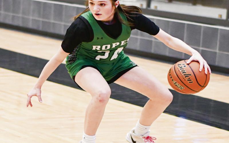 CROSS-OVER DRIBBLE - Ropes Lady Eagle Rylie Lester crosses over her dribble during their Area Round playoff game against Reagan County this past Thursday at Lamesa High School. (Staff photo by Jentezen Smith)