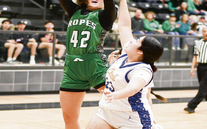 WORKING IN THE POST - Ropes Lady Eagle Annabelle Falls puts a move on a Reagan County defender to score in the post during their Area Round playoff game this past Thursday at Lamesa High School. (Staff photo by Jentezen Smith)