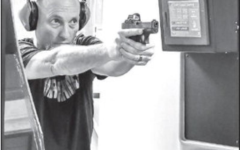 NEW SYSTEM - South Plains College Law Enforcement Instructor Mark Wittie demonstrated the new shooting range system on Monday. The new system is the culmination of two years of planning and work and is an integral part of the Law Enforcement Academy Curriculum. The range is also open to the public from 4-7 p.m. on Mondays while school is in session. (Staff photo by Jay Kelley)