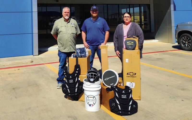 YOUTH LEAGUE SUPPORT - Through the Chevy Youth League Softball and Baseball program, Levelland Chevrolet donated equipment to the Levelland Youth Softball League for their upcoming season. Commissioner Jacob Tucker and Treasurer Tamara Whitley are pictured with Levelland Chevrolet, Buick and GMC Sales Manager Keith Kent. Kent presented the equipment to Tucker and Whitley Tuesday afternoon at the Levelland Chevrolet dealership. (Staff Photo)
