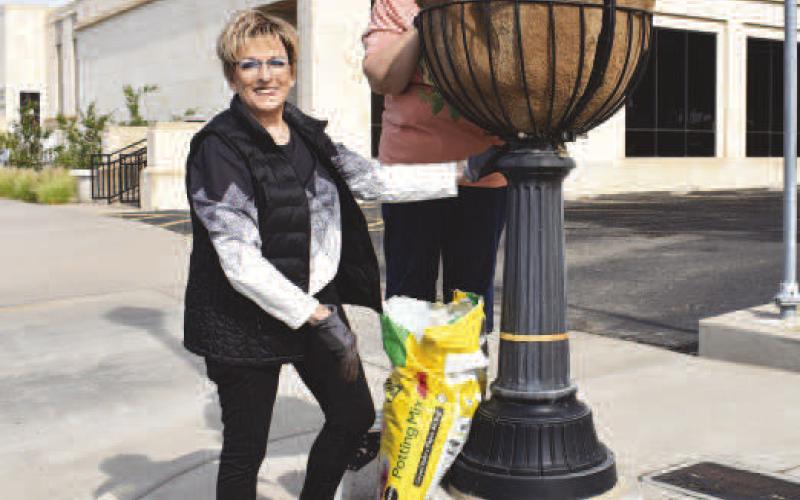 COMMUNITY PLANTING DAY - Community members patricipated in Saturday’s Community Planting Day which was hosted by the Levelland Main Street Program in downtown Levelland. Pictured is Mayor of Levelland Barbra Pinner and Connie Thomman enjoying their time planting their flowers.