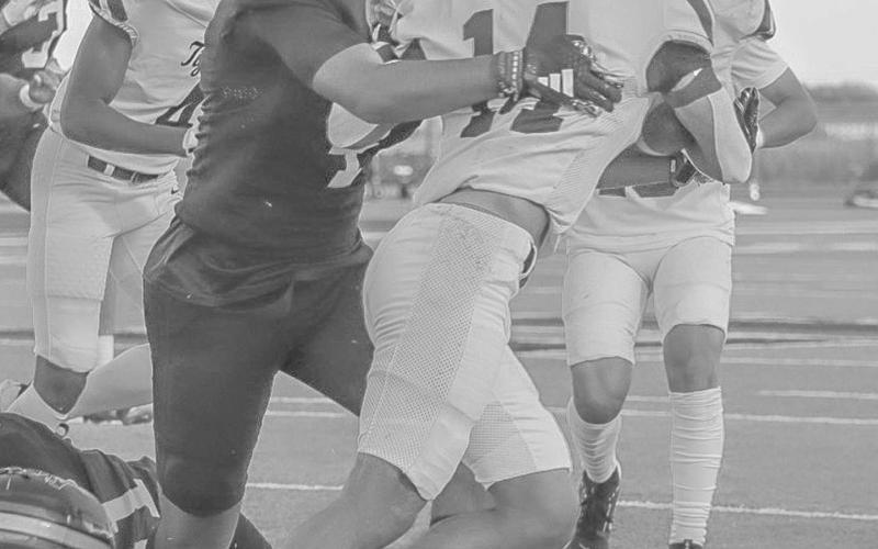 WRAP UP - Levelland Lobo Sean Landrum brought down the Snyder Tiger last Friday at home for the team’s last non-district game of the season. (Staff photo by Aalijah Soliz)