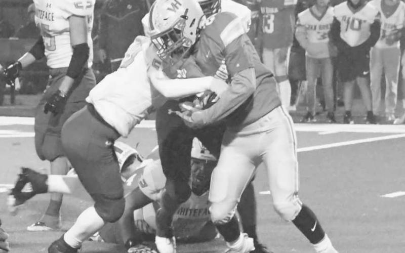 STAY DOWN - Defense is a hallmark of the Whiteface Antelope football philosophy. Jaxon Heflin and Auscar Gandara took a Van Horn runner down last Thursday in UIL Class 1A-1 high school bi-district action on their way to 58-8 win in Rankin. The Antelopes will face Borden County Friday at 7 p.m. in Slaton. (Staff photo by Jay Kelley)