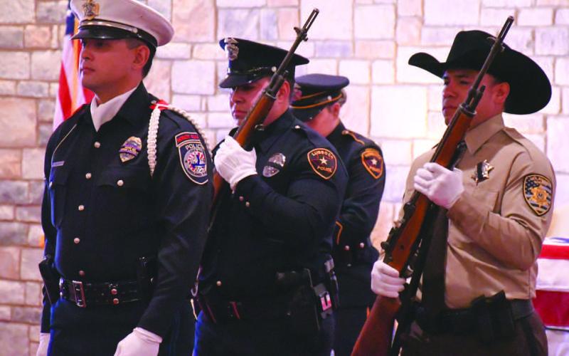 HONORING THE FALLEN - Several law enforcement personnel from various agencies across the region practiced handing off duties and going through the proper steps that are required to be a part of the honor guard during funeral services for a fallen officer. Pictured are law enforcement personnel protecting and guarding the casket. (Staff Photo)