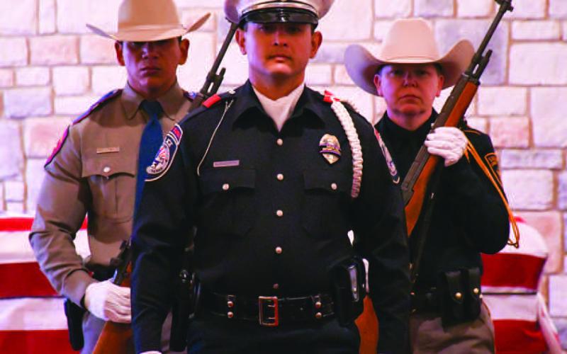 PRESTIGIOUS HONOR - Getting in their practice at the Krestridge Funeral Home Friday, various law enforcement agency personnel walked through the steps they had learned during the Honor Guard Academy class portion. (Staff Photo)