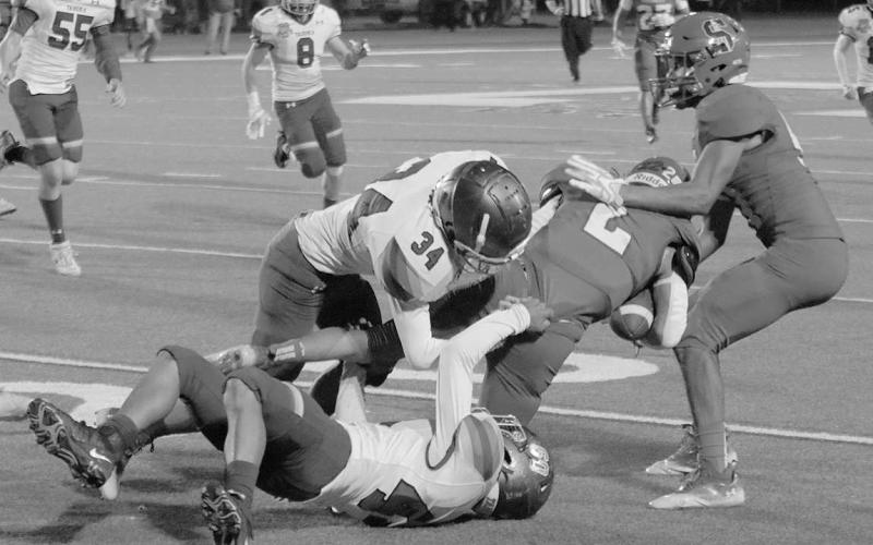 SCREEN PASS- Roughneck Jayson Martinez finished off a 15-yard screen pass by running through two defenders. The Roughnecks defeated Tahoka at home last Thursday and punched their tickets to the playoffs. The Roughnecks drew undefeated Stratford (10-0) for the first round of the playoffs to be played in Hereford on Thursday, November 10th. (Photo Courtesy of Chris Bratcher)