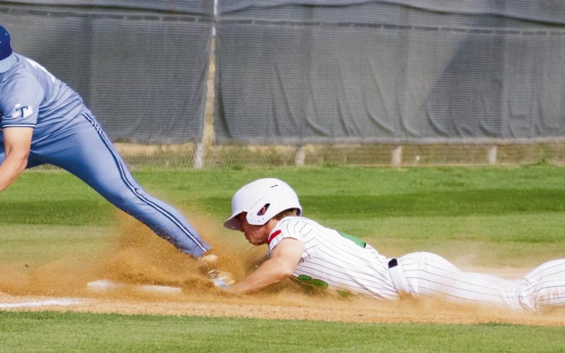 THE BASE THIEF - Ropes Eagle senior shortstop Ryland Kieth dives to steal third base during their district baseball game against Tahoka this past Friday at Ropes High School. (Staff photo by Eric Venkatesan)