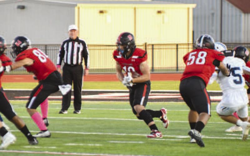 OPENING - Levelland athlete Rusty Johnson ran the ball during the teams loss to West Plains to pick up some much needed yards last Friday. (Staff photo by Dom Puente)