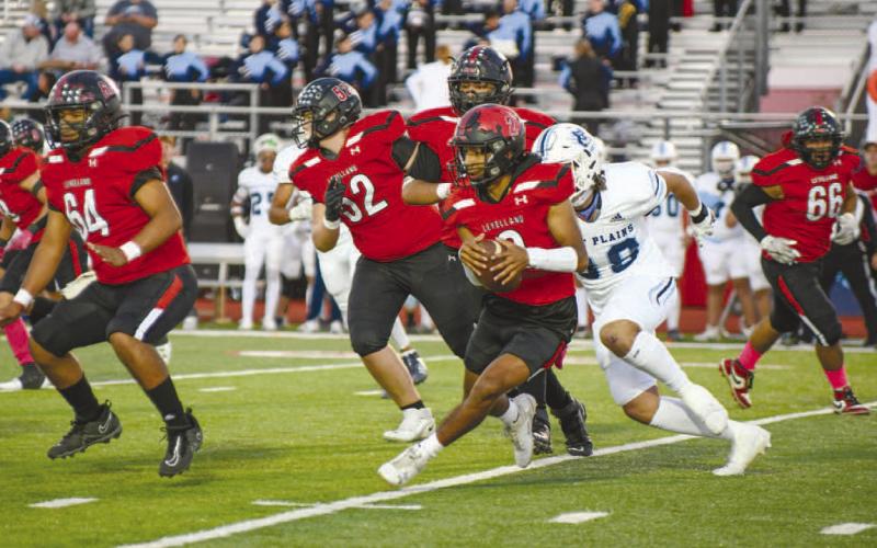 ELUSIVE - Levelland athlete Noah Martinez outran Wolves defenders in the teams loss last Friday night to pick up some much needed yards for the offense. (Staff photo by Dom Puente)