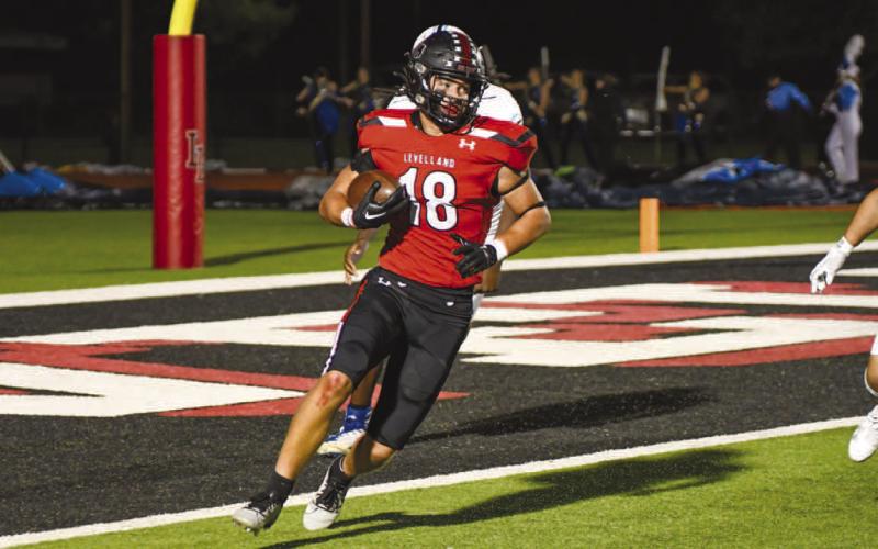 STRENGTH - Levelland athlete Austin Ellis ran the ball during the teams loss to the Wolves last Friday night. (Staff photo by Dom Puente)