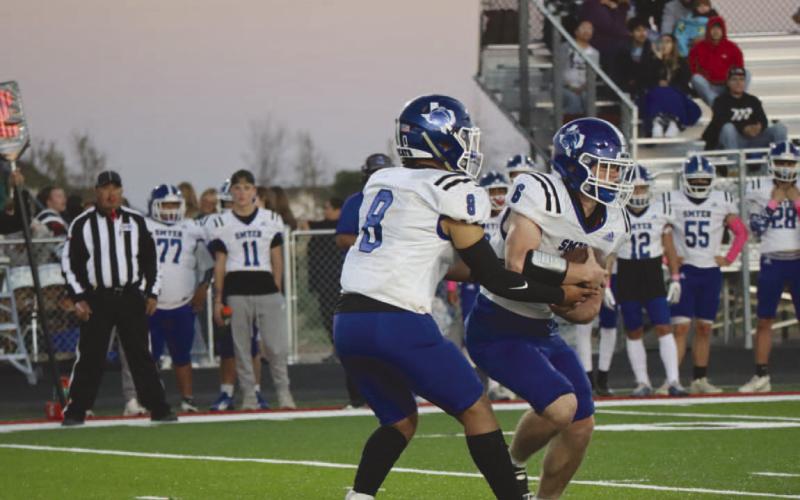 READ OPTION - Smyer quarterback and running back Peyton Casillas and Preston Moore were making a read on the New Home defense in the teams district loss last Friday. (Staff photo by Aalijah Soliz)