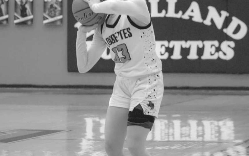 THREE - Levelland Loboette Presley Smith shot the ball from long-range during the team’s game against Odessa at home. (Staff photo by Aalijah Soliz)