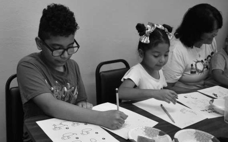 LIBRARY TIME - Brother and sister Aron and Valeria Mendez spend time at the Hockley County Summer Reading Program where they participated in drawing and coloring with each other and others that attended Wednesday at the Hockley County Library. The next Summer Reading Program event will be books and bagels Wednesday at 10 a.m. in the Hockley County Library. (Staff photo by Emily Campos)