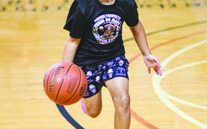 FAST BREAK – Gregory Phillips practiced his fast break dribbling during the Levelland Lobo Basketball Camp at the Texan Dome on August 5. (Staff photo by Jentezen Smith)