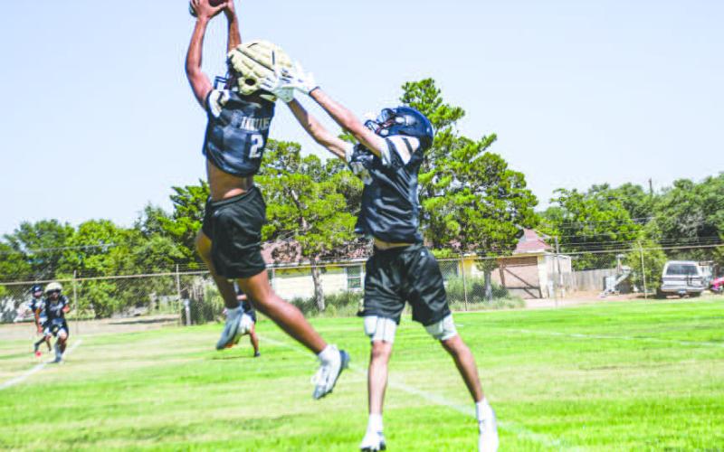 INTERCEPTED! - Two Morton football players go for a jump ball pass and defender Brayden Villarreal comes away with an interception during practice on August 5. The Indians will hold their first scrimmage of the season on Aug 15 at Plains beginning at 5 p.m. (Staff photo by Jentezen Smith)