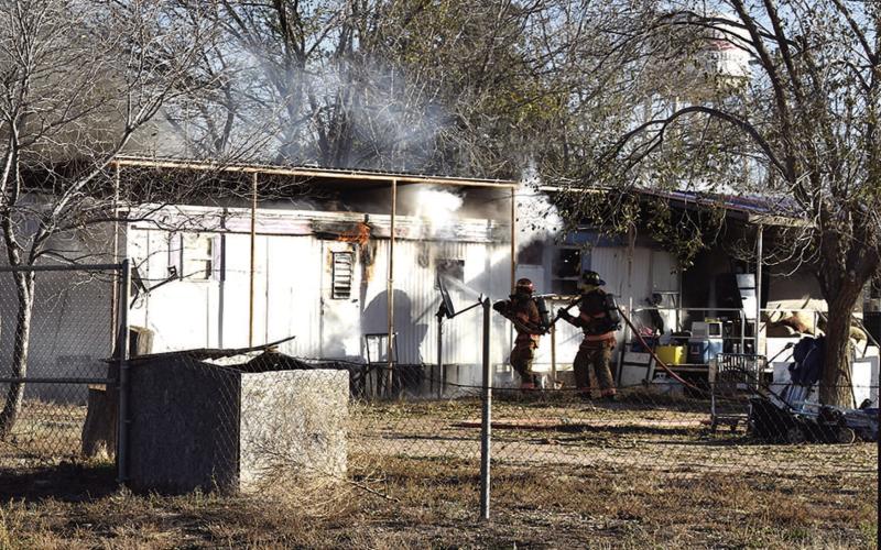 STRUCTURE FIRE - According to reports, a house fire broke out in the 1800 block of Houston Thursday morning. Two occupants were extracted from the residence with one being treated for smoke inhalation. The cause of the fire is believed to be electrical in nature. The Red Cross has been notified of the residence loss. (Staff Photo by DeeLaine Ruiz)