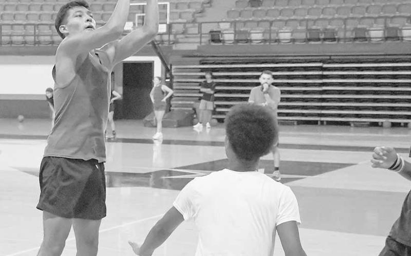 NICE SHOT - The Levelland Lobo High School coaching staff hosted a three-day camp focused on teaching youth players the fundamentals of the game. The camp began Tuesday and wrapped-up Thursday afternoon. Pictured is Levelland’s Elijah Salazar going up for a jump-shot during an open run during Thursday’s camp. (Staff photo by Dom Puente)
