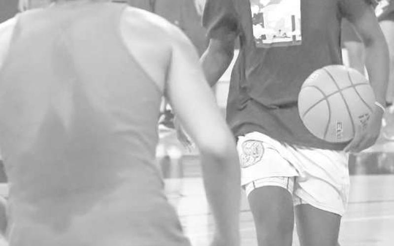 HANDLES - Youth area basketball players showed up for Levelland Basketball Camp at South Plains College earlier this week. The camp started on Tuesday and wrapped up Thursday afternoon. Pictured is Levelland’s Elijah Jordan pushing the ball up the up court during an open run at the gym. (Staff photo by Dom Puente)
