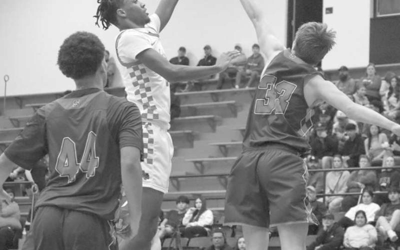SKY HOOK - Levelland Lobo Eryk Jones shot a sky hook over the Sundown defense during the team’s last non-district game of the season at home. (Staff photo by Aalijah Soliz)