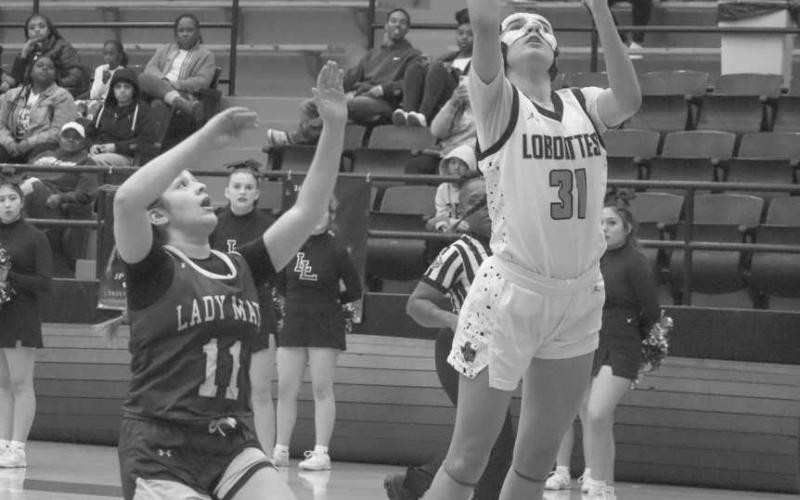 LAY-UP - Levelland Loboette Leilani Sanchez layed the ball up during the team’s fastbreak against the Estacado Lady Mats this past Tuesday at home. (Staff photo by Aalijah Soliz)