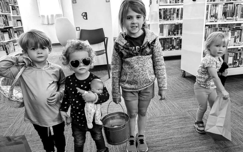 EGG HUNT- The City of Sundown Library hosted its first annual egg hunt for “Story Time” Monday, March 25. Led by library staffer Roxane Rivera, the group meets on Mondays at 10 a.m. and is open to all ages of growing readers. The hunters made bunny-eared hats and searched for cereal-filled eggs hidden throughout the new library. Attendees included: Ian (not pictured), in photo is Hannah, Eden, Hayes, and Hannah.(Photo courtesy of Sundown Library)