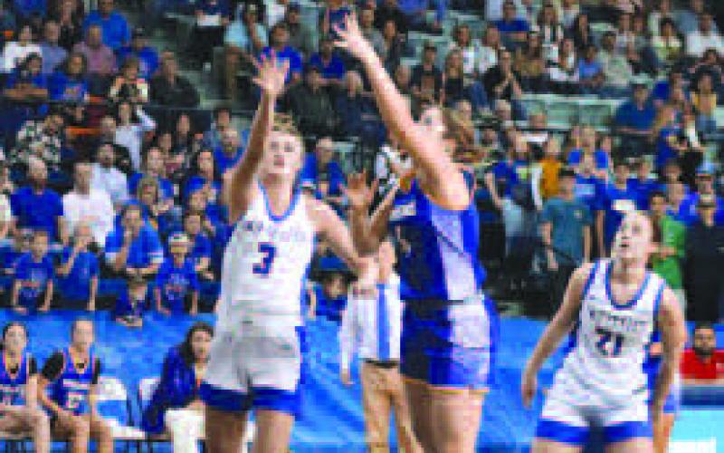 SKY HOOK - Lady Lope Morgan Waggoner shot the ball over the defense this past Friday for their basketball playoffs. (Staff photo)