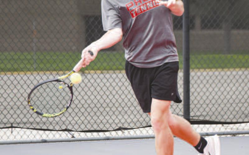 ON THE RUN – Pictured is Reese Payton swinging his tennis racket on the run as he drills keeping the ball in play during Levelland tennis practice. (Staff photo by Jentezen Smith)