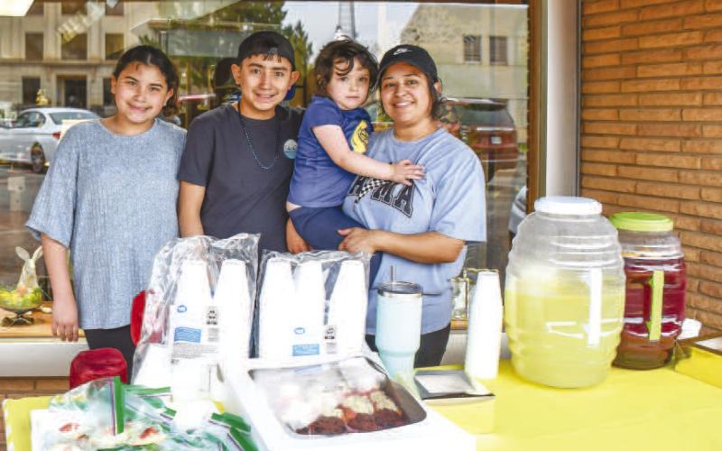 - Pictured from left to right are: Genesis Marin, Christopher Marquez, Emma Jordan and Kat Jordan. The group served up some fresh lemonade and baked goods for Main Streets Lemonade Day. (Staff photo by Hannah Woodrum)