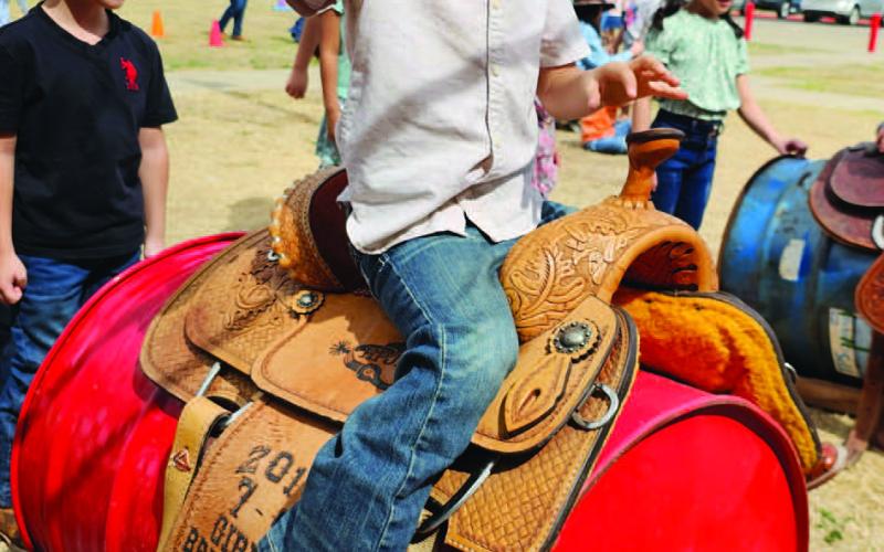 ABCTEXASPUBLICSCHOOLWEEK- Celebrating all things Texas at ABC students dressed like a Texan and enjoyed a hoedown, picnic lunches, planting, horse races, roping, and a Texas story. Pictured is Kindergartener William Frias trying out his roping skills. Frias parents’ are Yesenia and Juan Frias. (Photo courtesy of Cristal Isaacks)