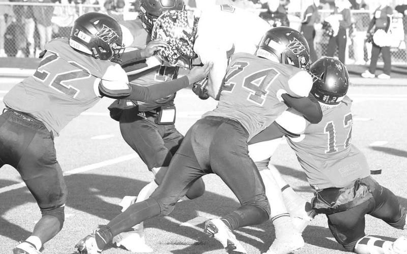 TEAM EFFORT- The Whitharral Panthers’ swarming defense was in action Saturday against the Benjamin Mustangs. Unfortunately, this time it wasn’t enough as the Panthers fell 76-31 in the UIL Class 1A-2 high school football sem-final game. Pictured are Shamadrick Weaver (22), Jack Griffin (11), Nomar Gomez (24) and Dawson Rodgers (12). (Photo Courtesy of Jay Kelley)