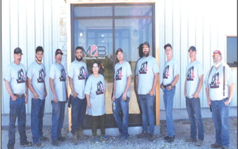 AWARENESS- The month of October is Breast Cancer Awareness month. M&amp;amp;B Roustabout Petroleum Products Company show their support in this photo with t-shirts that say “No One Fights Alone”. Pictured from left to right Clay Ainsworth, Cheaden Reyna, Osiris Sanchez, Noe Martinez, Cynthia Allison, Zack kidd, TJ Whetsel, Carey Kidd, Michael Lane and Tom Young.(Staff photo by Emily Campos)