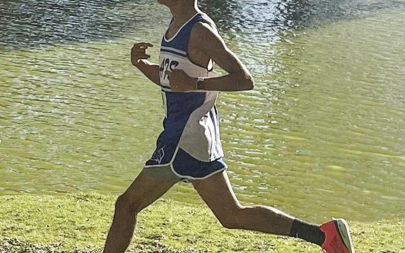 DISTRICT CHAMP - Senior Ismael Pizano competes in the District Meet at Yoakum Park in Denver City, Texas, this past Saturday. Pizano would go on to run a 15:45.14 to place first overall in the boy’s 5k run and become the District Champion. (Photo provided by Smyer ISD)
