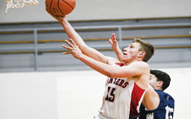 DOBROVOLNY TAKES FLIGHT - Whitharral Panther Hudson Dobrovolny takes flight for a layup during their game against Southcrest this past Thursday. (Staff photo by Jentezen Smith)