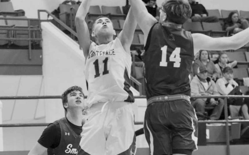 MEETAT THE RIM - Whiteface Antelope Cesar Chavez met Smyer Bobcat Rylan Smith at the rim during the team’s game in Whiteface. (Staff photo by Aalijah Soliz)