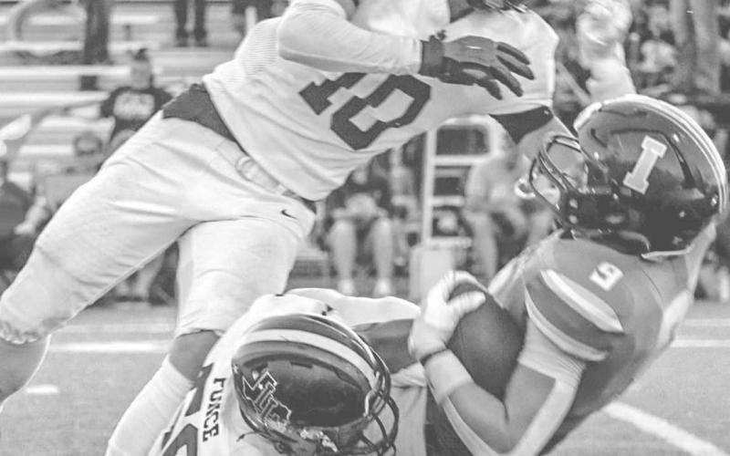 HIT STICK - Levelland Lobos Devin Ponce held the Idalou ballcarrier in place while Gage French layed him out for the forced fumble last Friday night. (Staff photo by Aalijah Soliz)