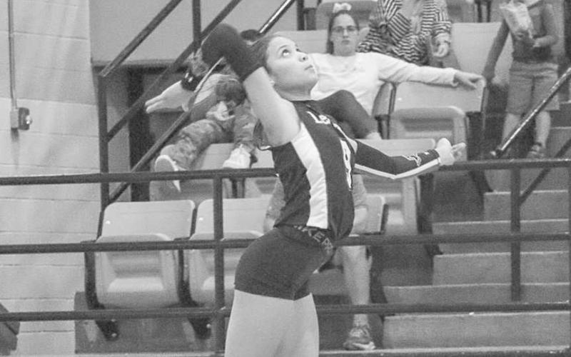 FOCUSED - Levelland Loboette Aubree Gaona served the ball against the Seminole Maidens this past Tuesday on the road. (Staff photo by Aalijah Soliz)