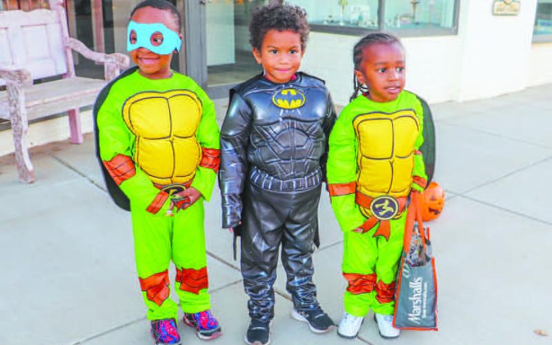 TRUNK OR TREAT FUN!- Kaydence, Kenzo and Ace all dressed as super heros and enjoyed Trunk or Treating on the Levelland square this past Thursday. Levelland Main Street and the Levelland Noon Lions Club hosts the event as a safe alterative for children in the community for Halloween. (Staff photo by Essence Childers)