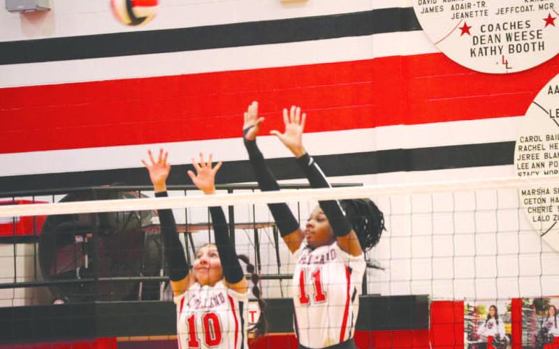 BLOCK PARTY - Levelland Loboettes Tanaesia Brackens and Mia Morin went up to block the shot last Tuesday in their dominant win against Sweetwater. (Staff photo by Aalijah Soliz)