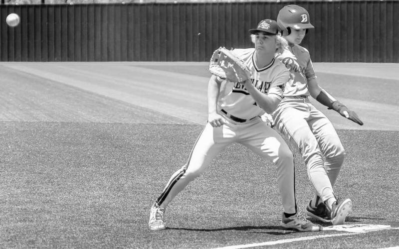 KEEPING HIM CLOSE - Senior first baseman Gage Potter received the throw from catcher RJ Mireles during game one of the bi-district round in Colorado City against the Brock Eagles this past weekend. (Staff photo by Dom Puente)