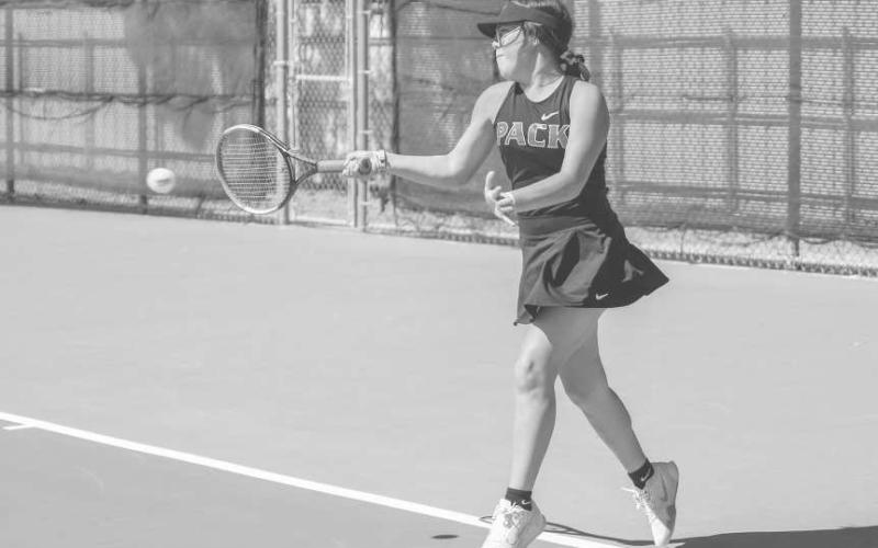 APOWERFUL SWING - Maddison Almager wrapped up her fall season with 12 wins and has a total of 35 varsity wins. Pictured is Almager returning a serve for a point. (Staff photo by Dom Puente)