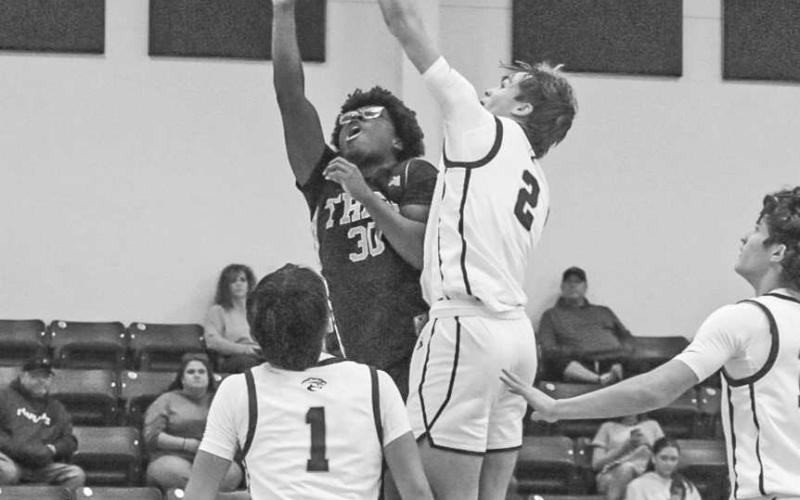 TOUGH SHOT - Morton Indian Tra Holland layed the ball up through contact during the team’s game against Klondike on the road. (Staff photo by Aalijah Soliz)