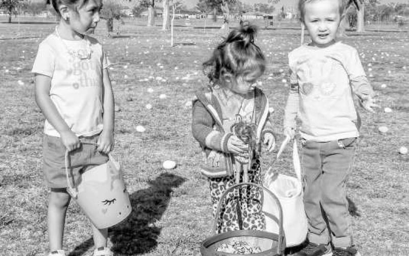 EGGS MARK THE SPOT - Any bunny else excited for Easter? These bunnies were at the Easter Egg hunt at the City Park near Pavillion One on Saturday. Pictured from left to right are: Yareli Sanchez, Hallie Pinkert and Dylan Huber. (Staff photo by Hannah Woodrum)