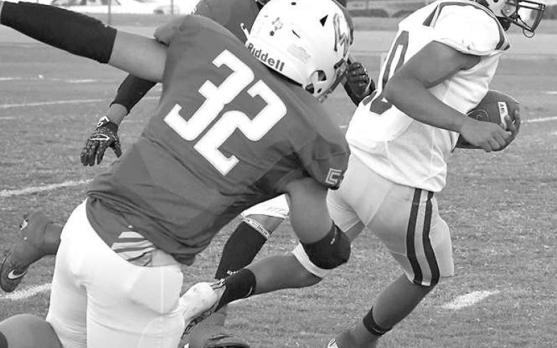 FINDINGSPACE- Gavin Martinez split Whiteface defenders in a 53-6 road loss for the Anton Bulldogs in UIL high school six-man action last Friday. The Bulldogs host Spur Friday at 7:30 p.m. while Whiteface heads to Wildorado for a 7:30 p.m. game. (Photo Courtesy of Jay Kelley)