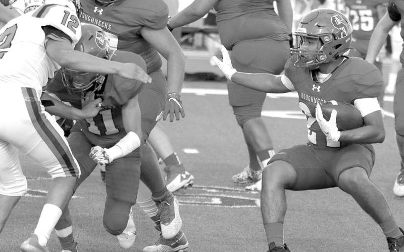 SLIP BEHIND A BLOCK- Sundown Roughneck Isaiah Flores made a cut and slipped behind blocker Michael Salazar. The Roughnecks hosted the Wink Wildcats for homecoming and fell, 56-14. Sundown will travel to Roosevelt to play a tough Eagle squad on Friday, September 23rd. (Photo Courtesy of Chris Bratcher)